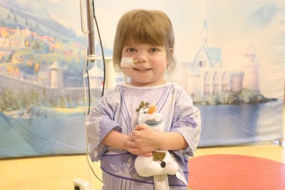 Young patient wearing the Frozen-themed Starlight Hospital Gown