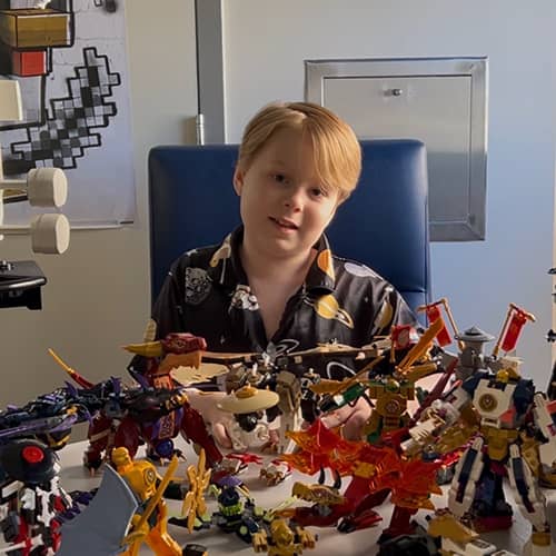 Jameson playing with LEGO sets in hospital