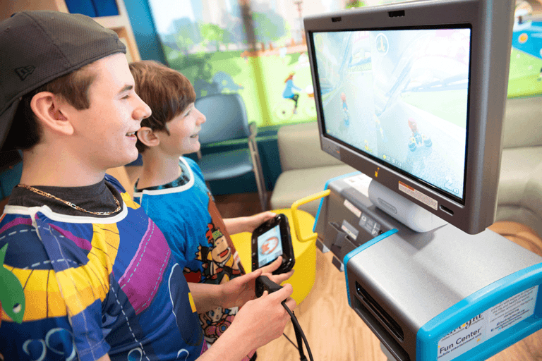 Two boys playing Gaming console