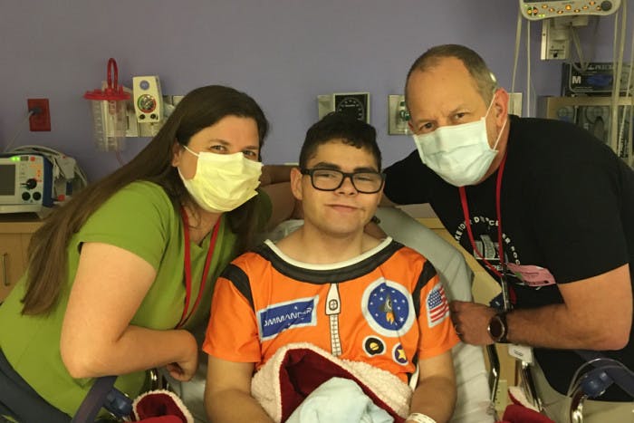 Starlight kid luke in the hospital with his family
