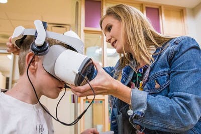 child life specialist helping child with VR